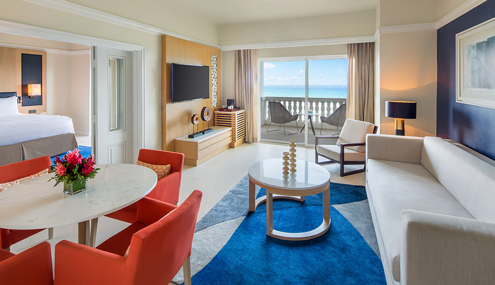 The hotel suite at Hyatt Zilara Rose Hall resort with dining area, seating area, balcony and bedroom