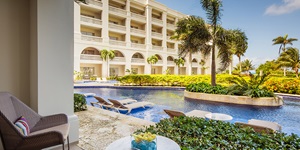 A shot of the pool and exterior of a Hyatt hotel in Jamaica