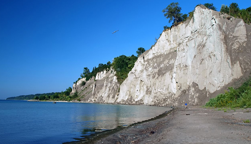 Large walls of rocks stand on Bluffer's Beach off the coast of Lake Ontario