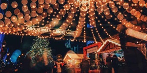 Gorgeous lights line the sky above the Christmas market in Toronto's Distillery District