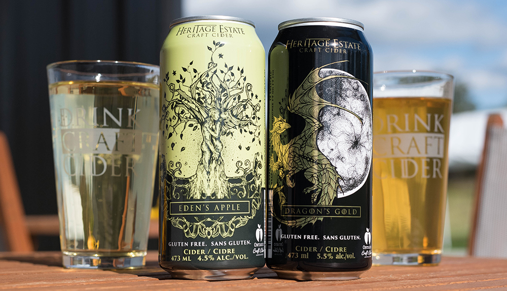 Couple of tall cans of cider and full glasses of them from the Heritage Estate Winery and Cidery
