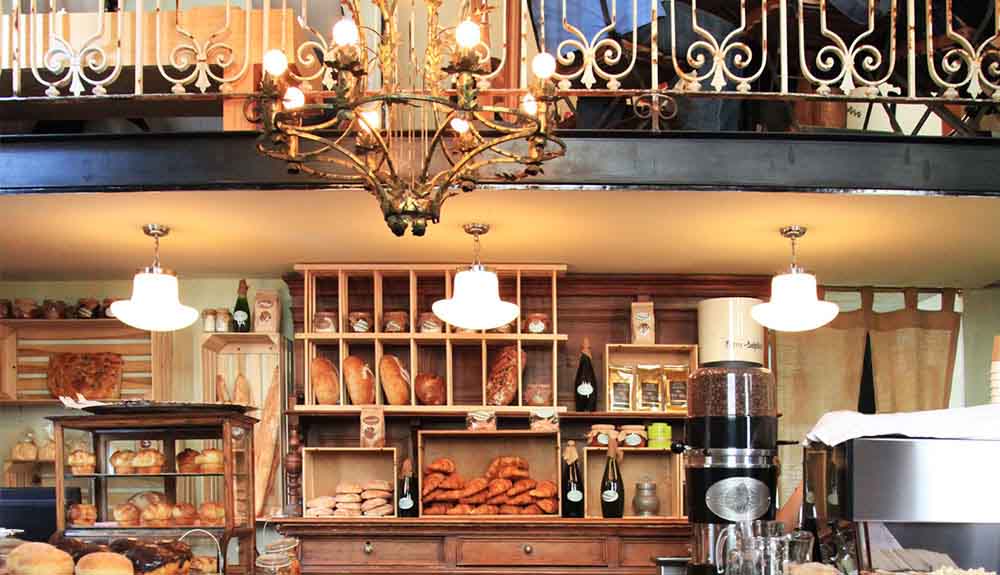 Inside Elena Reygada's popular bakery featuring shelves full of bread