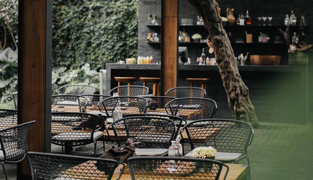Cute empty Mexican patio with a bar in the background