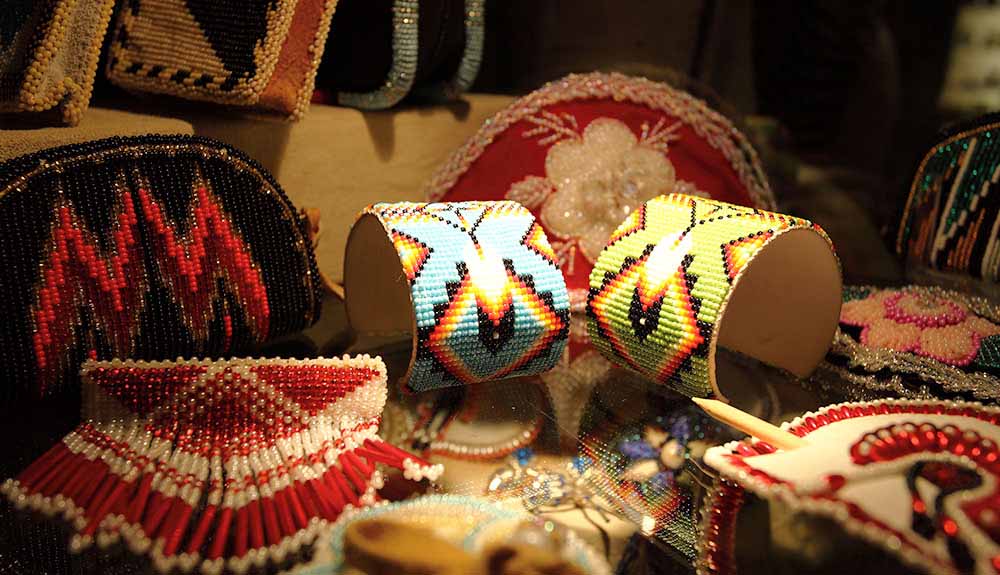 Various beaded handcrafted jewelry by Indigenous people featured at The Canadian Canoe Museum
