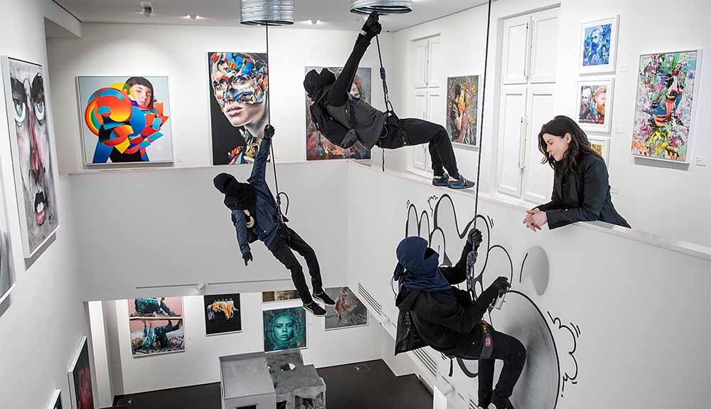 A visitor looks at an exhibit for the Museum for Urban Contemporary Art