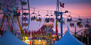 The Ferris wheel and skyway at dusk at the Canadian National Exhibition in Toronto