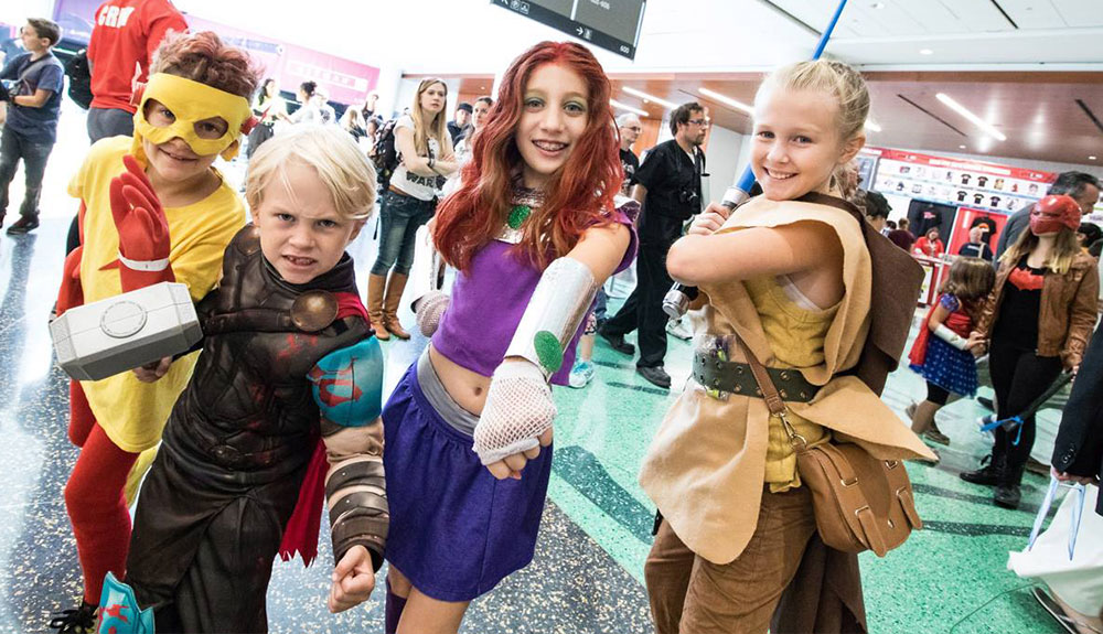 Kids are shown dressed in costumes at Toronto Comicon