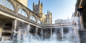 Steam rising from the waters in the courtyard of a stunning building in a small city off the beaten path