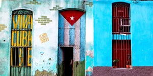 The Viva Cuba slogan and the Cuban flag decorate doorways in Havana