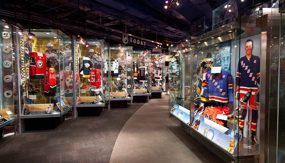 Jerseys displayed in glass cases are on exhibit at the Hockey Hall of Fame, in Toronto, Ontario