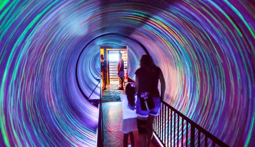 Exploring an exhibit about optical illusions at Ripley's Believe it or Not! in Niagara Falls, Ontario