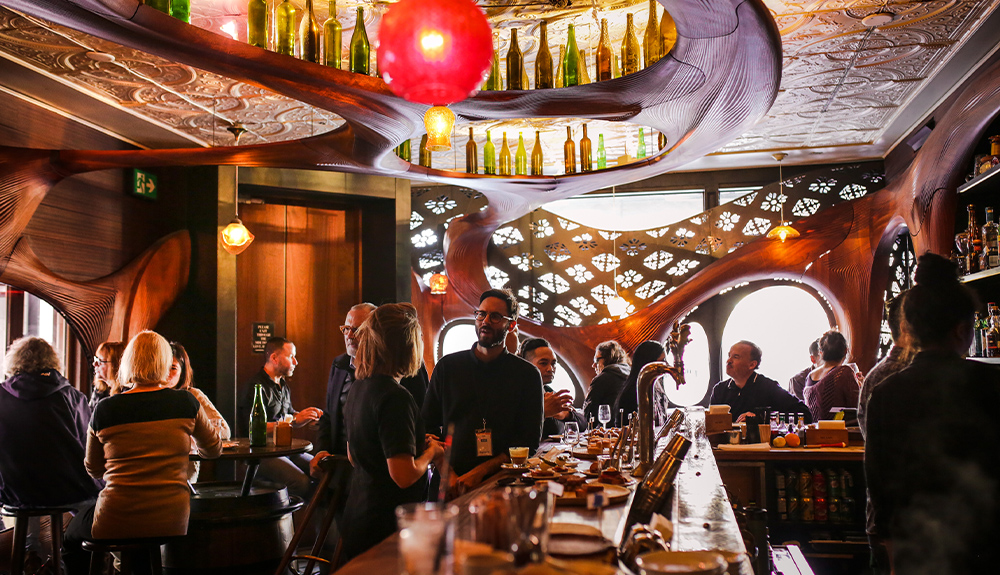 A bar filled with fashionable people.