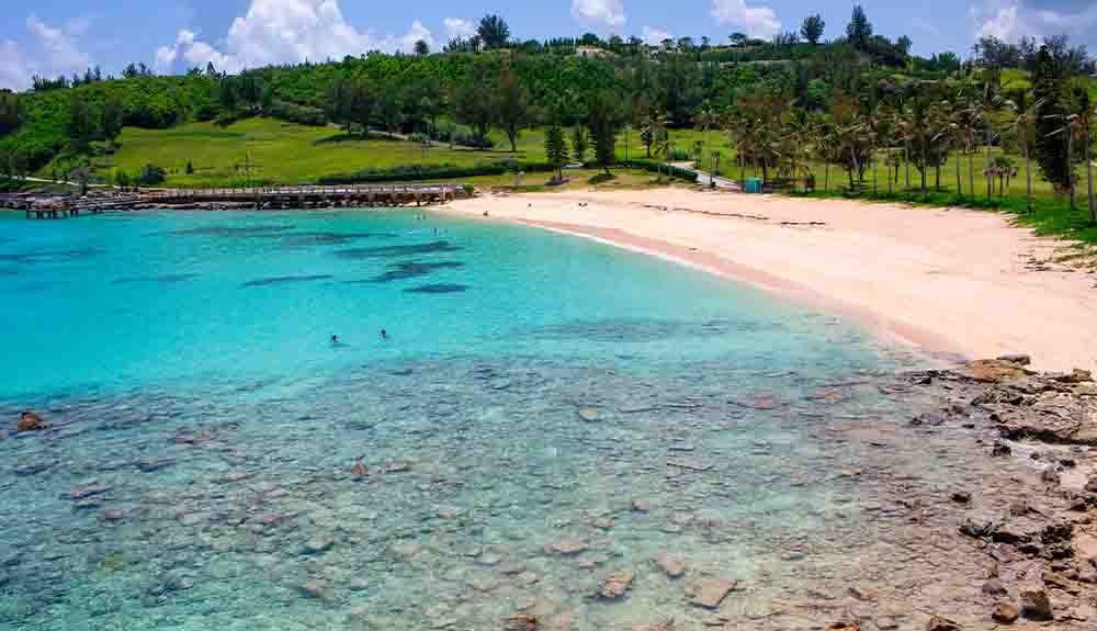 A pink sand beach in Bermuda is shown