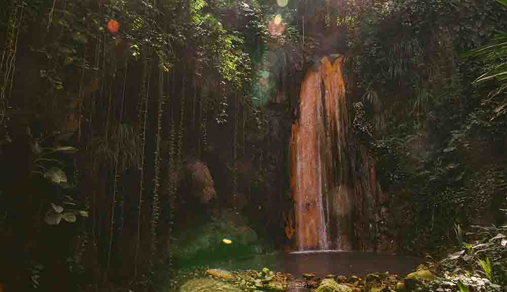 A waterfall is shown in St. Lucia
