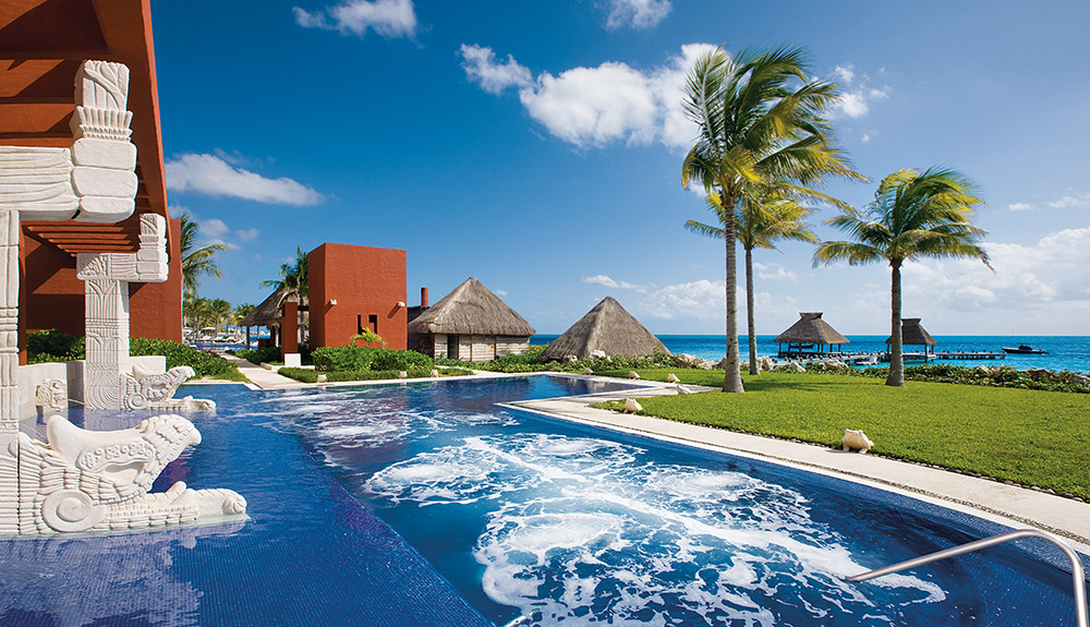 Jets swirl in a large pool on a beautiful sunny day at the Zoetry Paraiso de la Bonita in Riviera Maya, Mexico