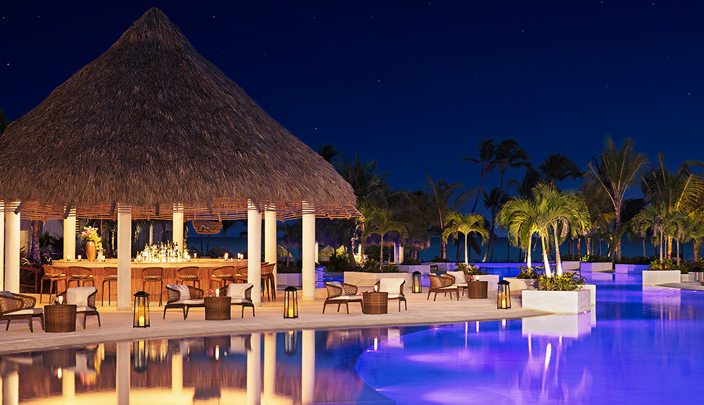 A poolside tiki bar is seen near a quiet pool at the Secrets Cap Cana resort in the Dominican Republic