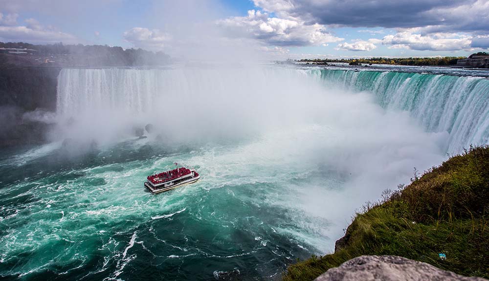 A boat floats away from Niagra Falls