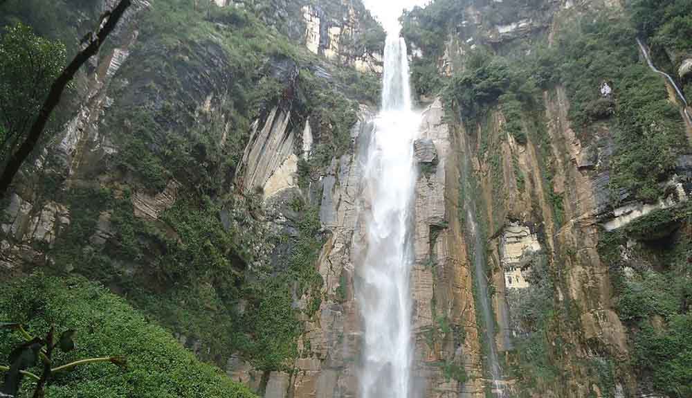 A view from below shows water streaming down Yumbilla Falls in Peru