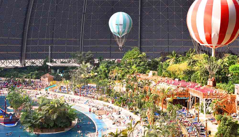 Hot air balloons float above the world's largest indoor rain forest