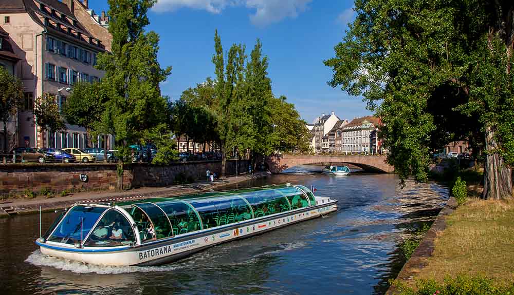 The River III floats down the river in Strasbourg in the daytime