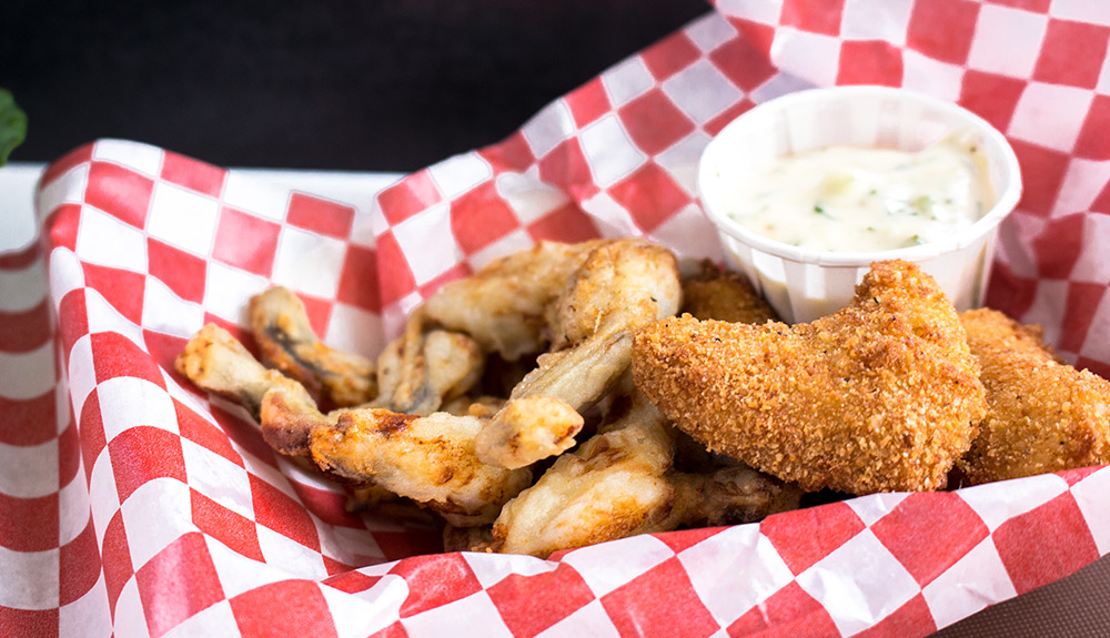 Takeout platter with deep fried frog legs and ranch dip, as seen at the CNE