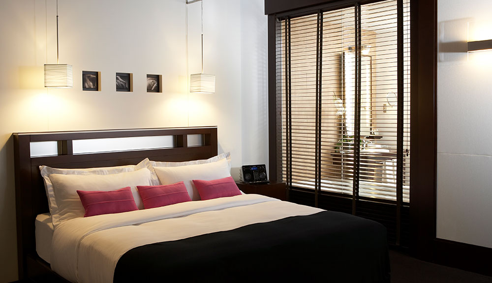 A well made bed at Hotel le Germain