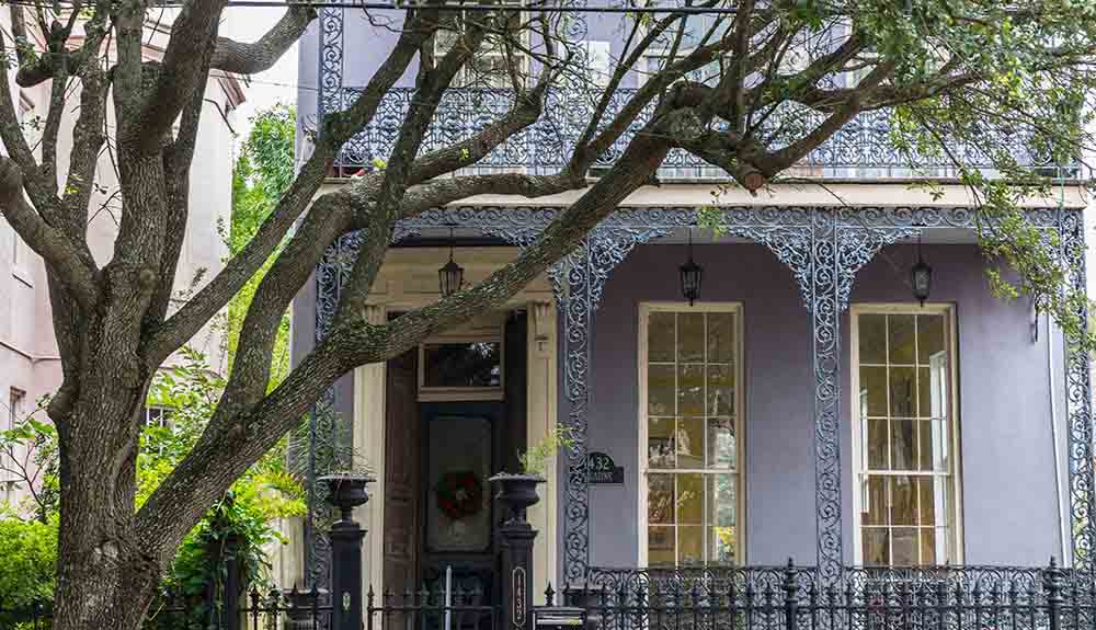 Light purple building with stunning details in the genteel Garden District