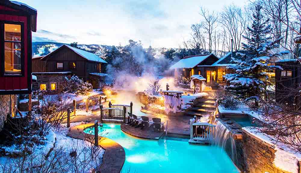 Hot pools of water beautifully lit at dusk in the winter