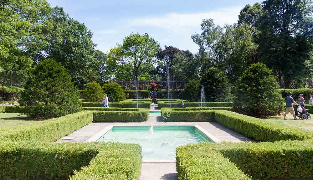Beautiful garden featuring a water fountain in High Park