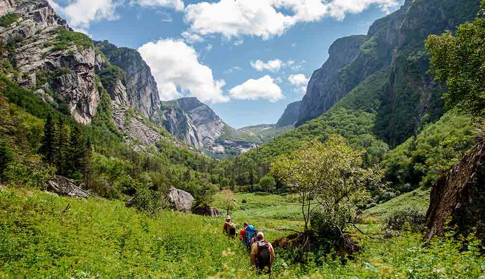 A group of four people hiking through Gros Morne National Park