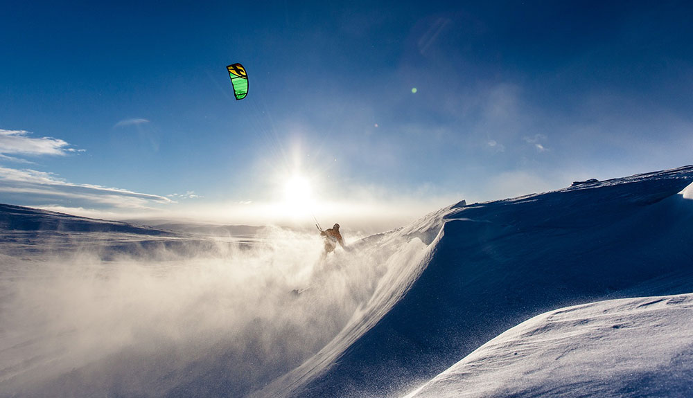 Person snowkiting on the snow in the winter