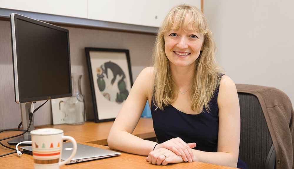 University of Toronto researcher Jennifer Stellar sitting at her desk