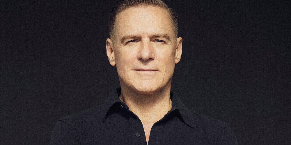 Singer Bryan Adam dressed in a black shirt