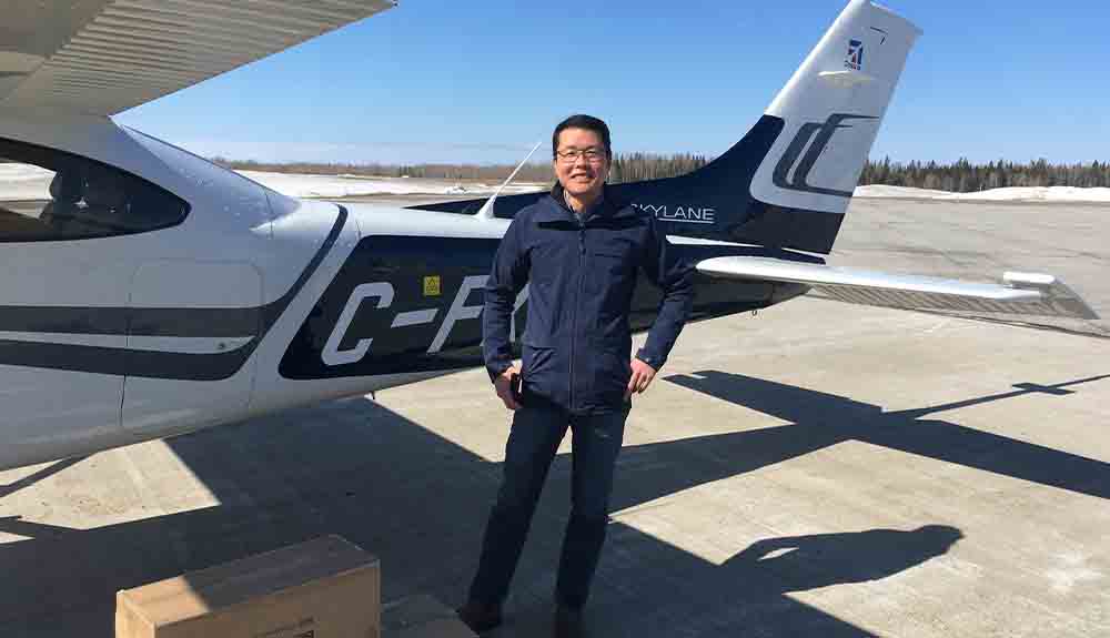 CAA Club Group President Jay Woo stands next to his plane before a volunteer flight for Hope Air