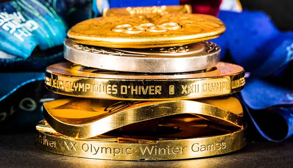 Stack of five Olympic gold medals