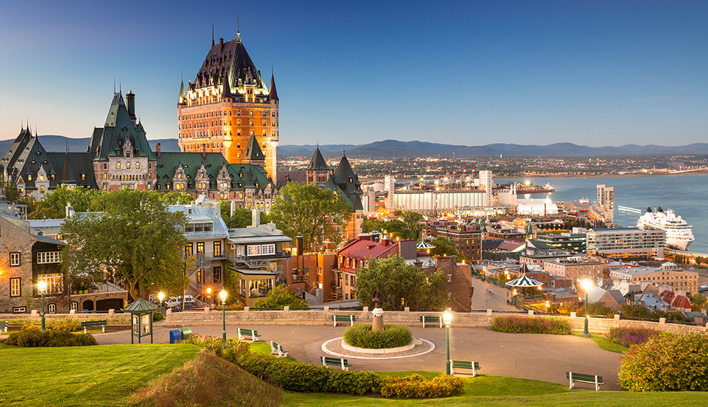 Landscape shot of Quebec City seen in the evening sky, streetlights just turned on