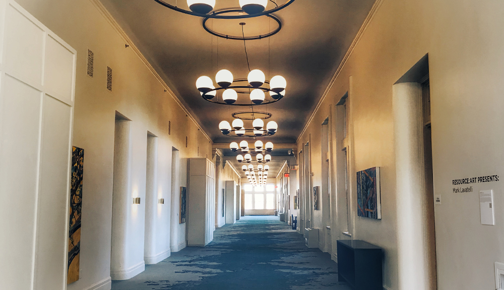 Spooky white hallway of empty former state asylum in Buffalo