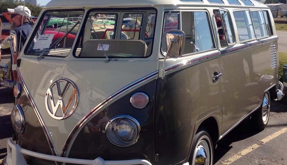 Dark brown and grey 1964 VW Samba 21 seen parked in busy lot