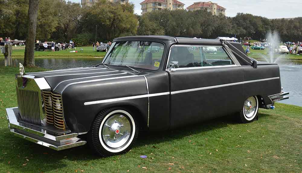Black 1973 Mohs Safarikar parked on grass beside small lake