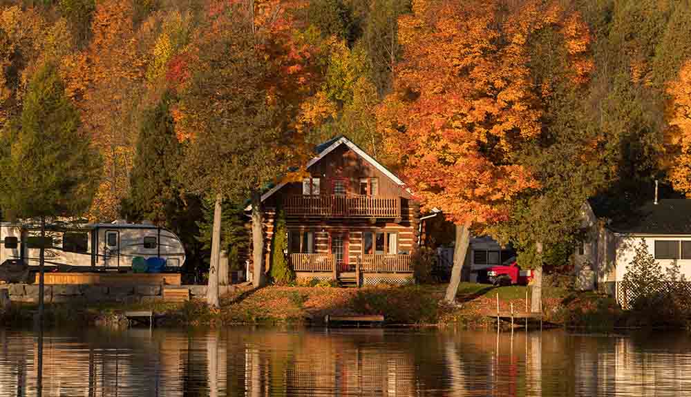 Wooden cottage beside a calm lake in Kawarthas Northumberland