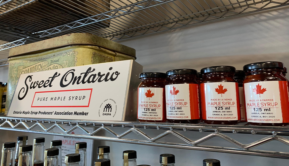 Jars of maple syrup on a shelf