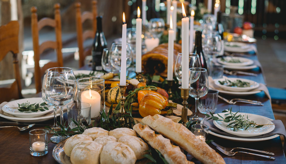 A long dining table is set for a formal meal