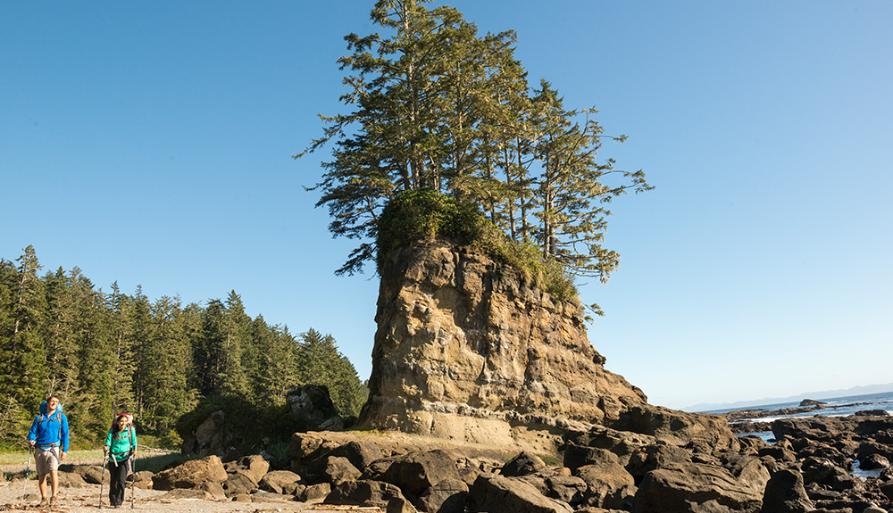 Hikers pass rock formations along the West Coast Trail in B.C.