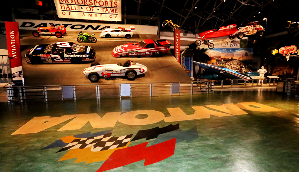 Race cars are seen zipping by on the track at the Daytona International Speedway