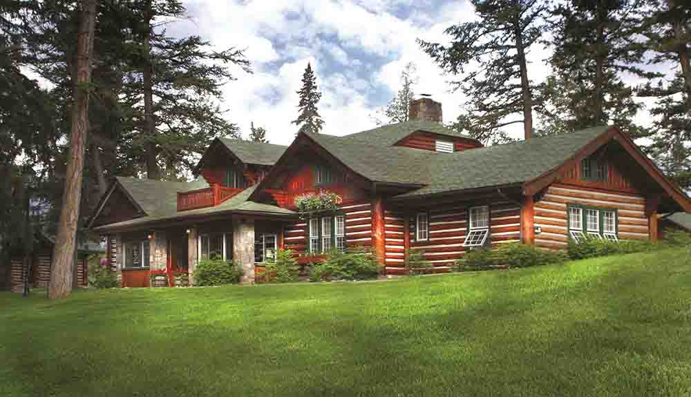 An expansive log cabin is shown at the Fairmont Jasper Park Lodge
