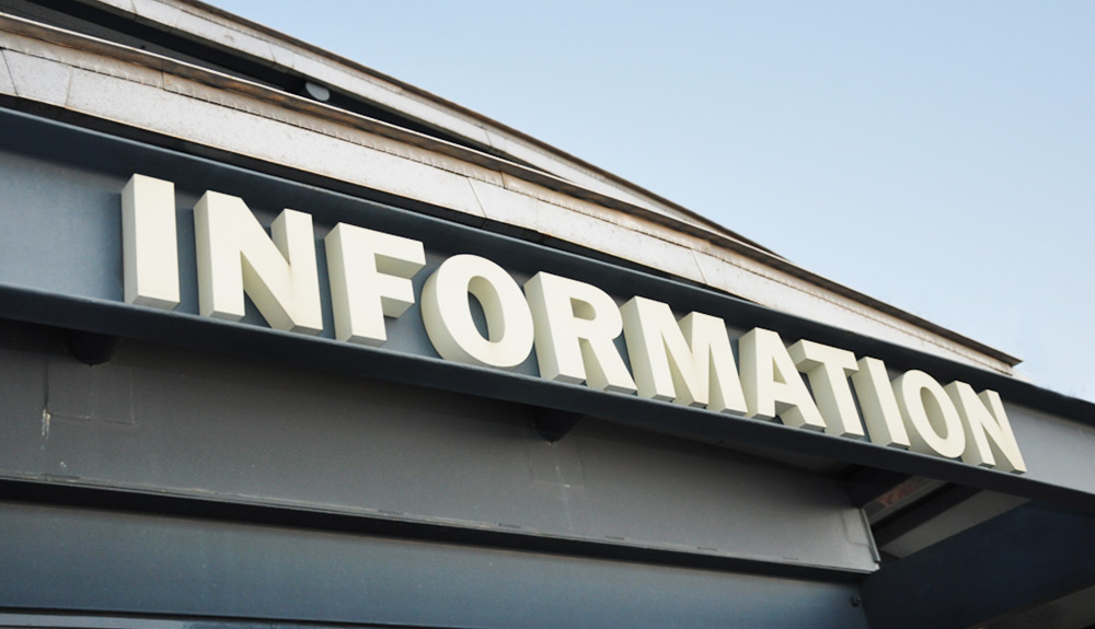 A sign identifies a building as an Information Center