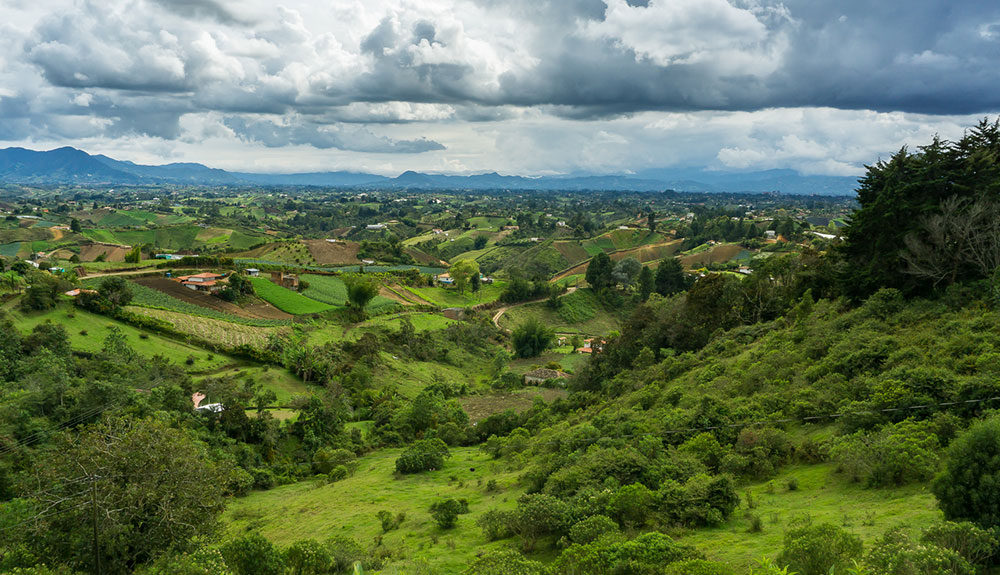 An aerial view of the beautiful green hills and countryside of Colombia