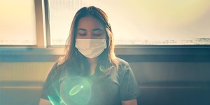 Woman wearing face mask to prevent illness