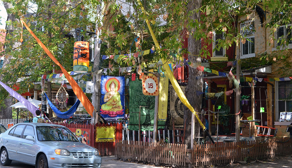 Tapestries hang in front of stores in Kensington Market