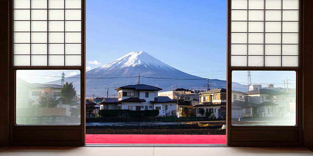 The view of Mount Fuji is seen from sliding doors at a Japanese hotel